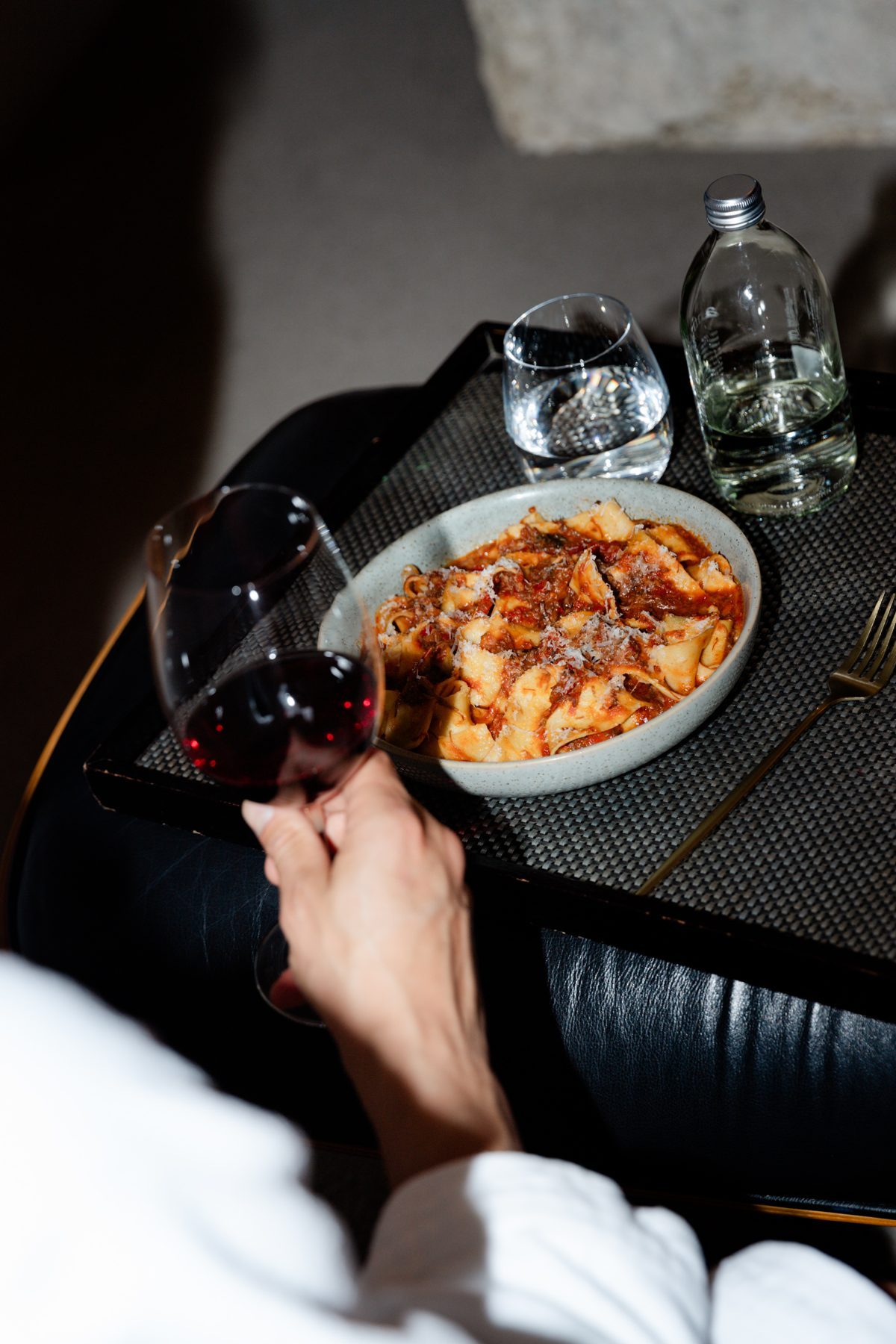 Photo: Natasha Ruiz Pappardelle and a glass of red, in-room dining
